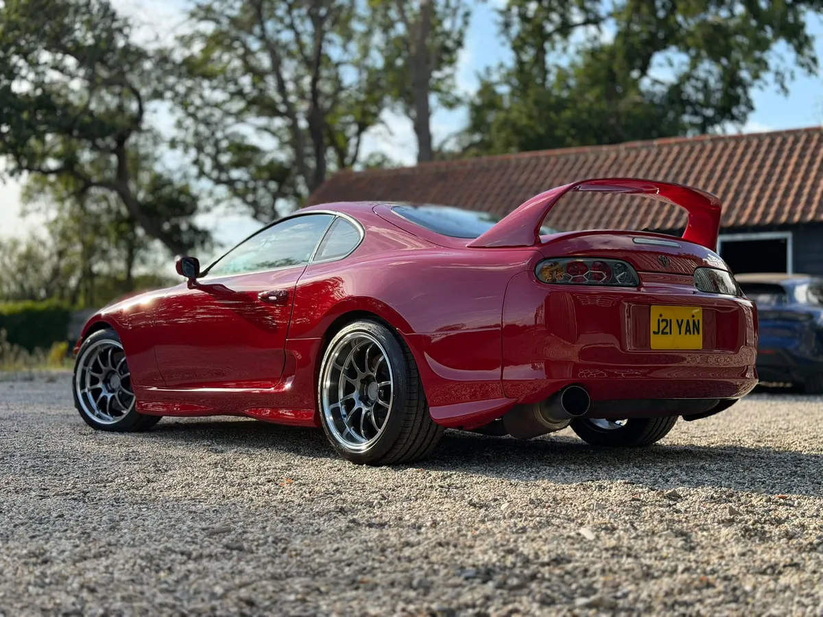 Red Cupra with a mirror finish in the evening sun