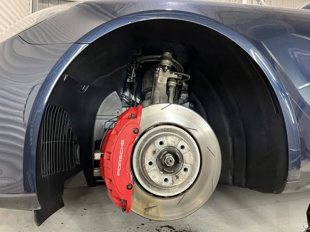 Porsche brake caliper and disc after detailing