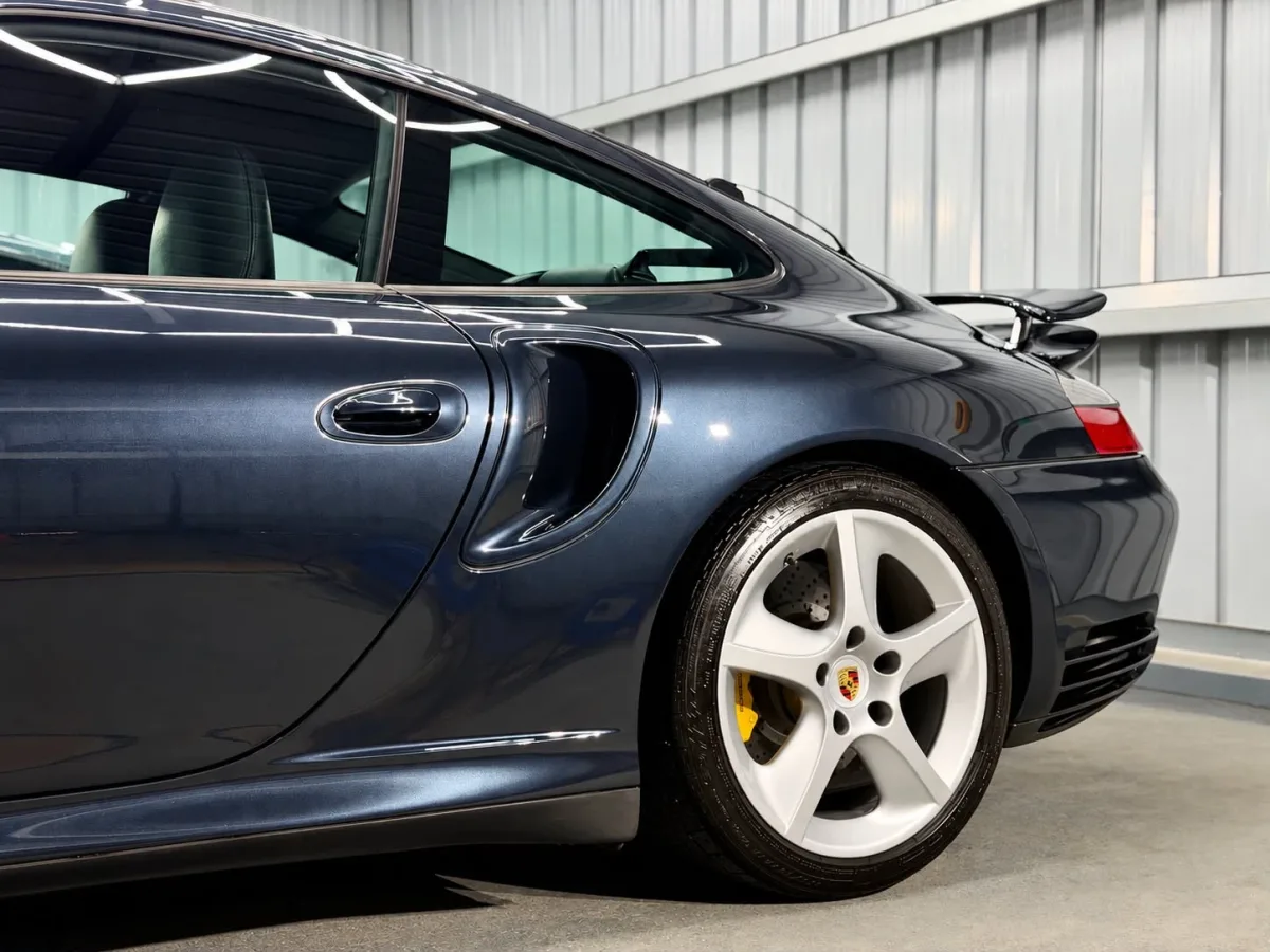 Dark blue Porsche 911 Turbo with a deep gloss finish in the Day One Detailing unit
