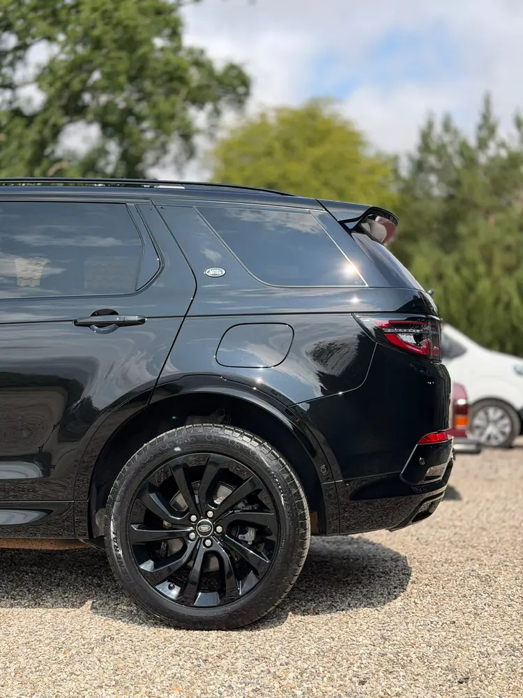 Black Land Rover Discovery Sport rear three-quarter after detailing