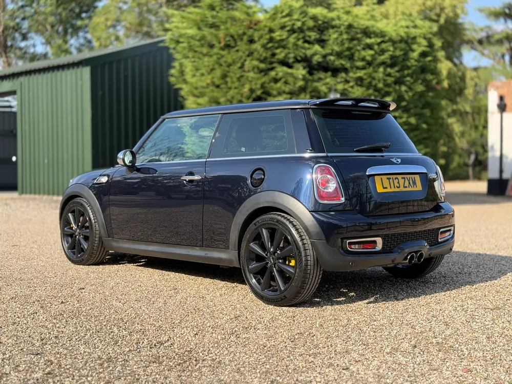 Dark blue Mini Cooper with yellow brake calipers after detailing