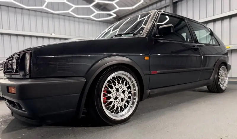 Black Volkswagen Golf Mk2 on BBS wheels in the Day One Detailing unit